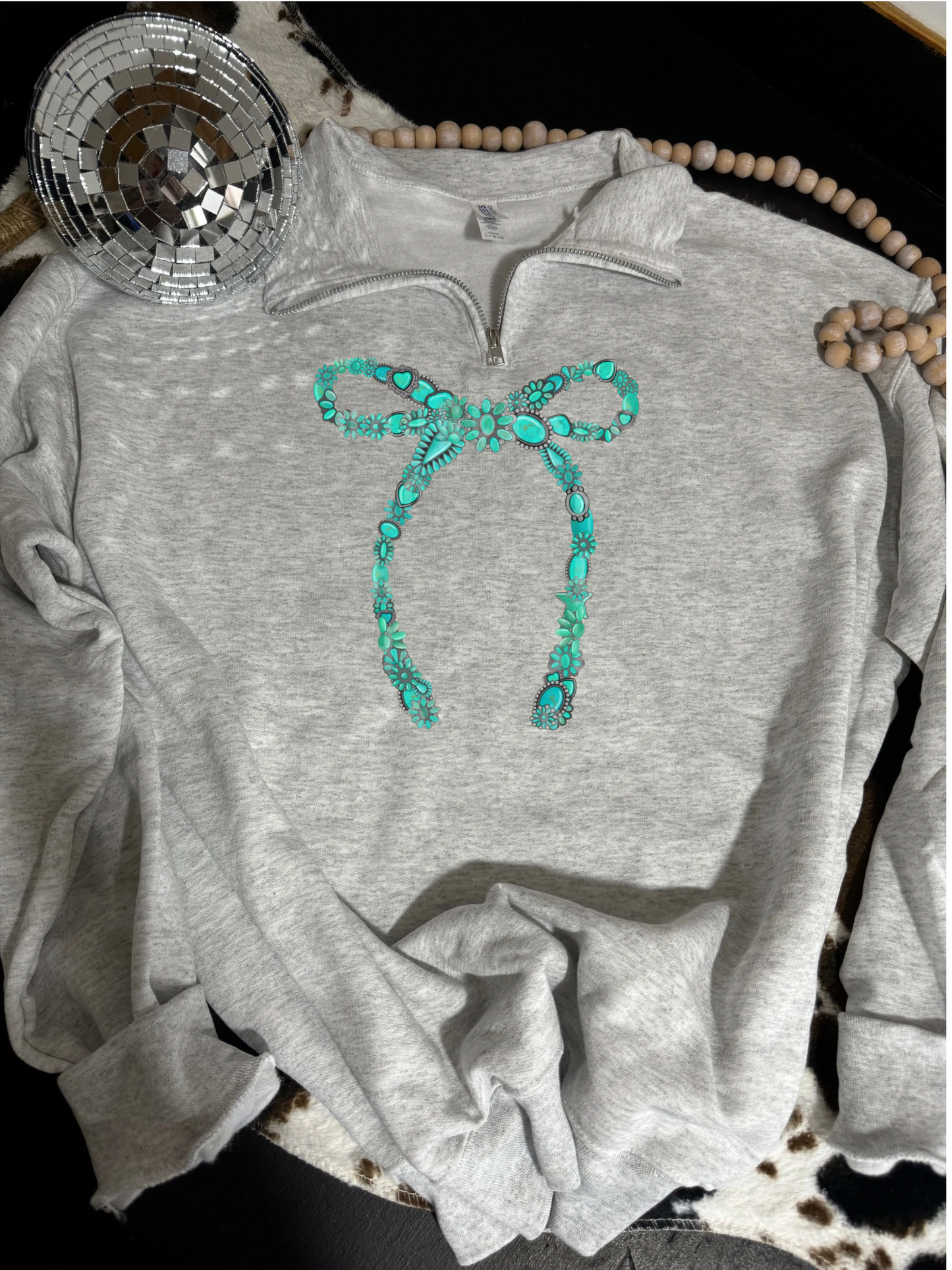 Turquoise bow quarter zip